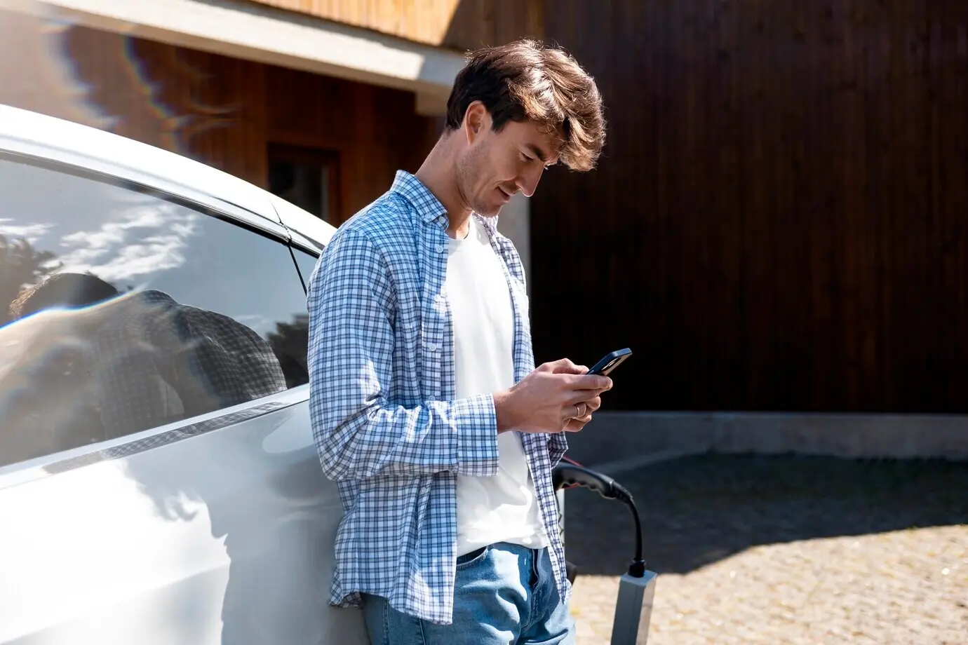 Person tending to an electric car