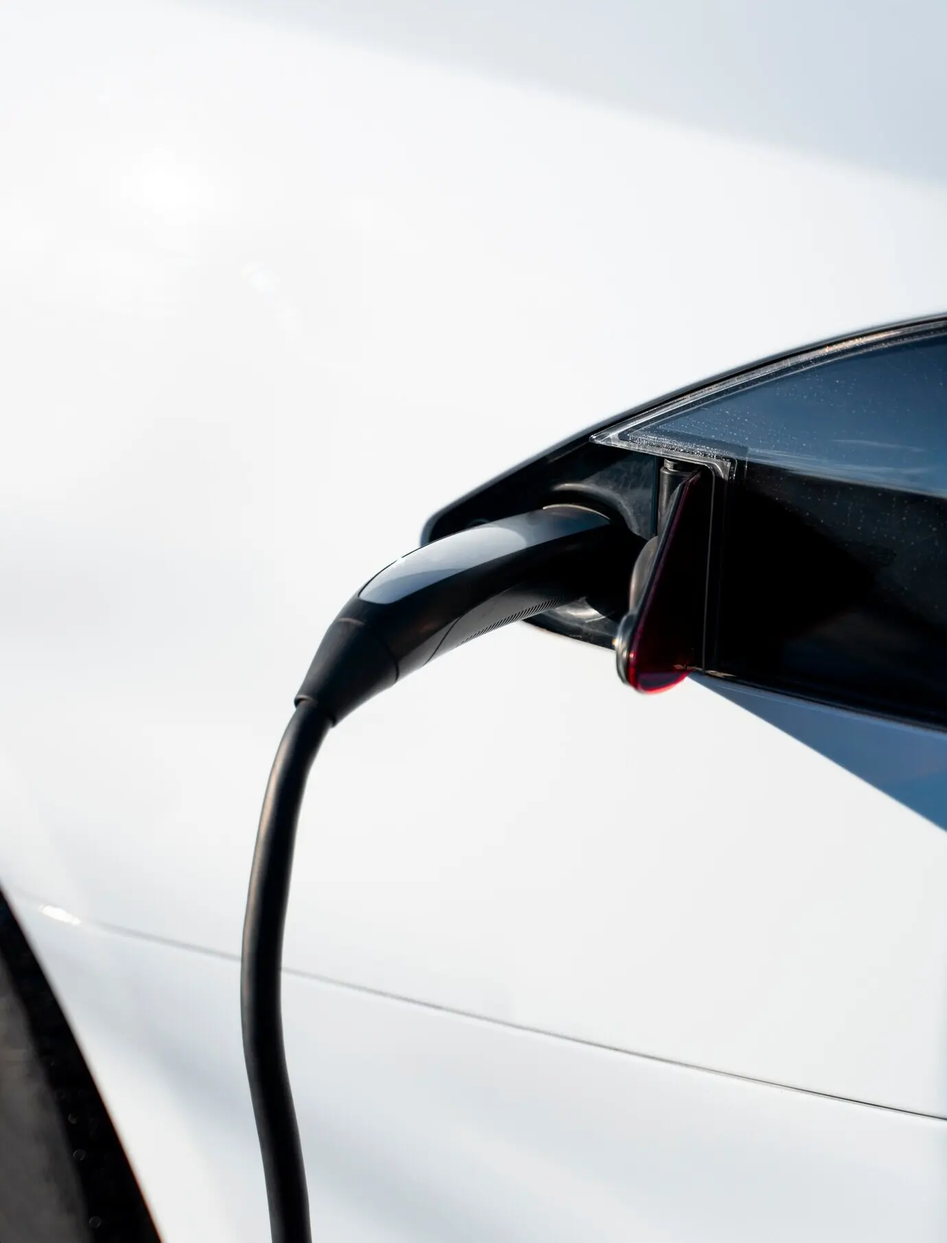 Close-up of an electric car charging.